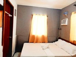 Postel nebo postele na pokoji v ubytování Gaea's Apartments