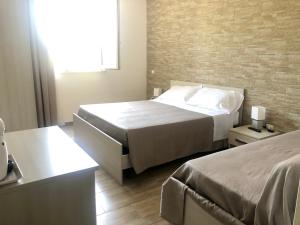 Postel nebo postele na pokoji v ubytování Messapia Casa Vacanze