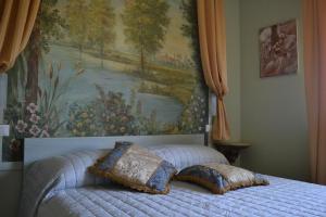 Postel nebo postele na pokoji v ubytování Riflessi d'Arte