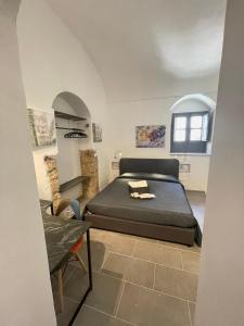 a bedroom with a bed and a chair in it at Il Telescopio in Noto