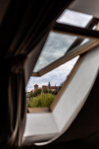 a view through a window of a building at Hotel Rubinstein in Krakow