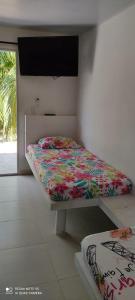 Posteľ alebo postele v izbe v ubytovaní cabañas del caribe La Bonga