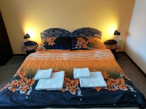Säng eller sängar i ett rum på Penzión Baltazár