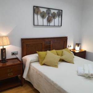 Llit o llits en una habitació de Apartamento ideal para familias