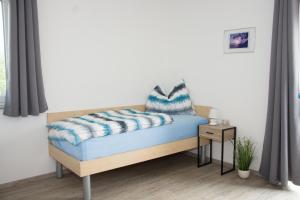 Letto o letti in una camera di Helis Gästezimmer