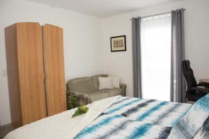 Letto o letti in una camera di Helis Gästezimmer