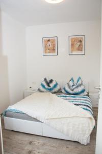 Letto o letti in una camera di Helis Gästezimmer