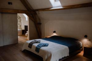 Katil atau katil-katil dalam bilik di Aletheia - Beautiful holiday home in renovated farm in Flemish Ardennes