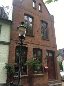 a street light in front of a brick building at Townhouse in Friedrichstadt