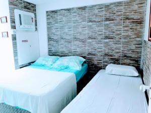 Ένα ή περισσότερα κρεβάτια σε δωμάτιο στο Ancorar Resort em Porto de Galinhas
