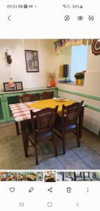 a dining room table with two chairs and a table at Przytulny apartament-cosy and beautiful in Żywiec