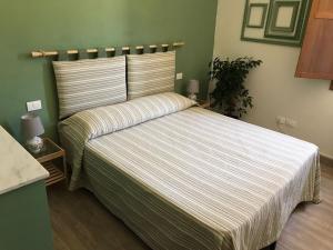 Postel nebo postele na pokoji v ubytování Residenza San Matteo