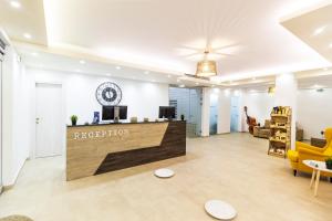 a reception area of a hotel lobby with a reception desk at Hotel Odysseas in Polychrono