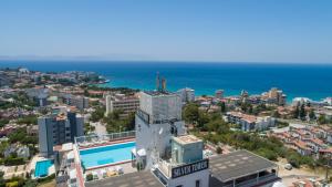 an aerial view of a city and the ocean at Silver Tower Residence in Kusadası
