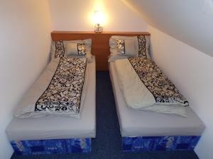 A bed or beds in a room at U Křemílka