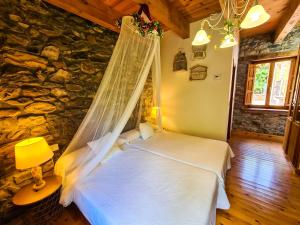 Postel nebo postele na pokoji v ubytování El Molino de la Ropería