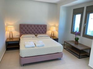 Ένα ή περισσότερα κρεβάτια σε δωμάτιο στο Luminous Luxury Apartments