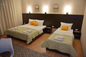 Postel nebo postele na pokoji v ubytování Apartmani Tomić