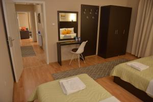 Postel nebo postele na pokoji v ubytování Apartmani Tomić
