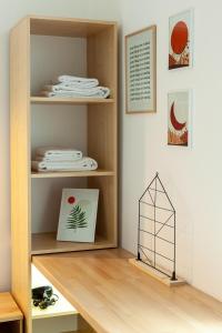 a room with a wooden shelf with a notebook on it at Check-in Apartments in Lviv