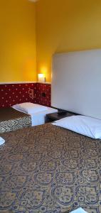 Posteľ alebo postele v izbe v ubytovaní Hotel Laguna Residence