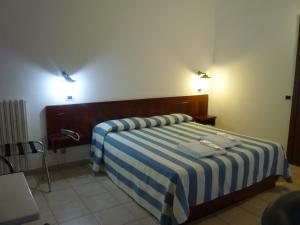 Postel nebo postele na pokoji v ubytování Hotel L'Ancora