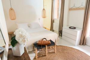 Postel nebo postele na pokoji v ubytování Hotel Home Arcachon