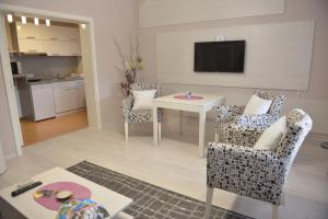 Kuchyň nebo kuchyňský kout v ubytování Apartmani Tomić