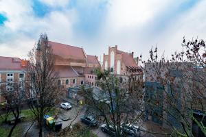 a view of a city with buildings and cars at Lux Apartment in white in Gdańsk