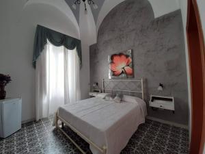 Postel nebo postele na pokoji v ubytování Palazzo del SalTo