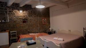 A bed or beds in a room at Il Rifugio di Bomar
