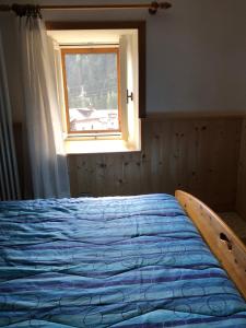 Postel nebo postele na pokoji v ubytování Case vacanze Desiree