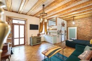 a living room with a couch and a table at Saint John's 22 Brasov in Braşov