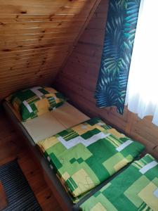 Postel nebo postele na pokoji v ubytování Domki Lazur