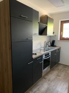 Kuchyň nebo kuchyňský kout v ubytování Katschi Lodge