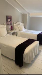 Een bed of bedden in een kamer bij Hotel Boutique Albussanluis