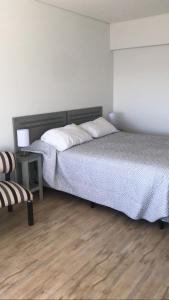 Ένα ή περισσότερα κρεβάτια σε δωμάτιο στο Buenos Aires Apart