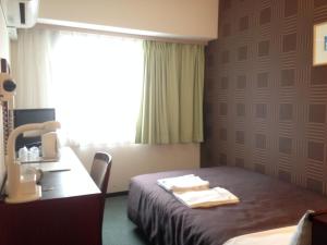 Postel nebo postele na pokoji v ubytování Hotel Select Inn Nagano + 34 fotografií