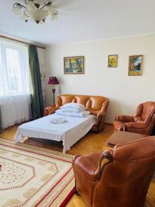 Een bed of bedden in een kamer bij Guest House at Lesya Ukrainka