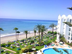an aerial view of a resort with a pool and the beach at Ona Marinas de Nerja Spa Resort in Nerja