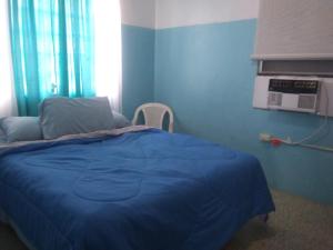 Ένα ή περισσότερα κρεβάτια σε δωμάτιο στο Brisas de Borinquen
