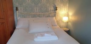 Voodi või voodid majutusasutuse Farnham House toas