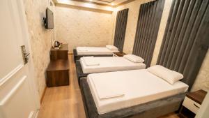 Postel nebo postele na pokoji v ubytování DYMAR HOTEL