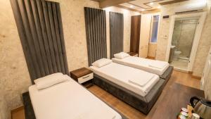 Postel nebo postele na pokoji v ubytování DYMAR HOTEL