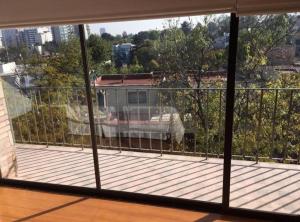 a view of a balcony from a window of a building at Casa amplia en Lomas de Chapultepec in Mexico City