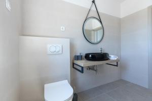 Kúpeľňa v ubytovaní APARTMANI OLIMP