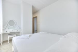 Posteľ alebo postele v izbe v ubytovaní APARTMANI OLIMP