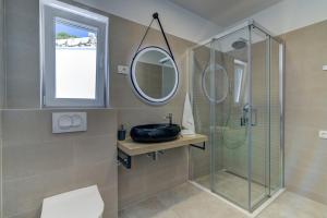 Kúpeľňa v ubytovaní APARTMANI OLIMP