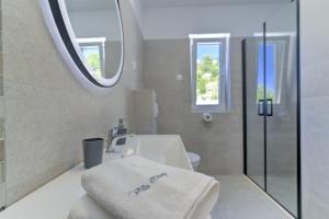 Kúpeľňa v ubytovaní APARTMANI OLIMP