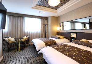 Postel nebo postele na pokoji v ubytování APA Hotel Ueno Ekimae